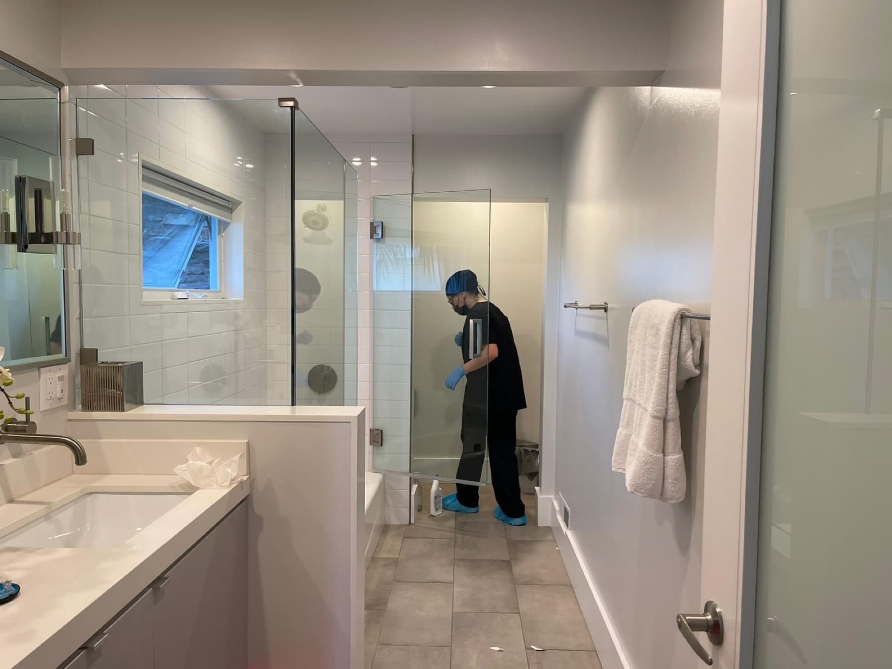 Detailed bathroom cleaning with protective gear